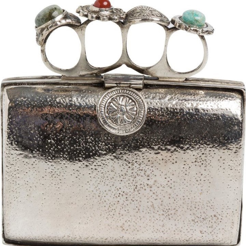 From St Xavier silver ring clutch